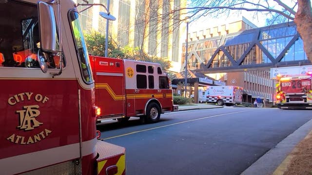 Crash traps elderly woman under vehicle at Atlanta hospital parking deck