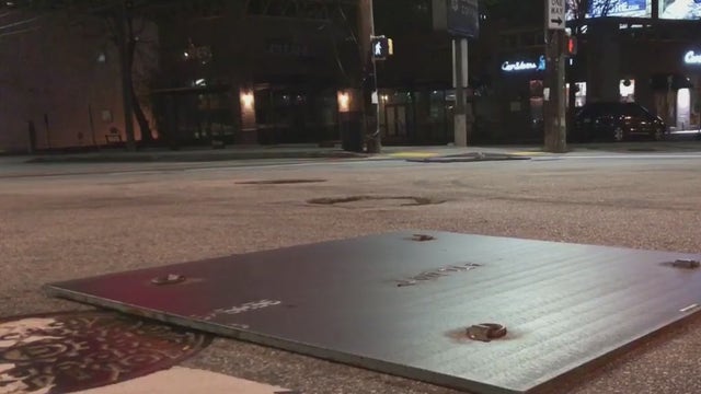 Steel plates aim to deter drivers from burning rubber at rainbow crosswalk intersection