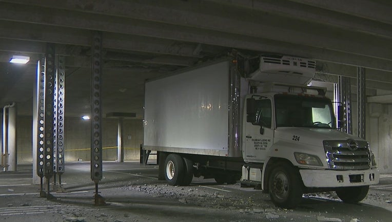 Firefighters say a box truck hit 3 concrete columns, destabilizing a parking deck at an Atlanta Walmart on March 11, 2022.