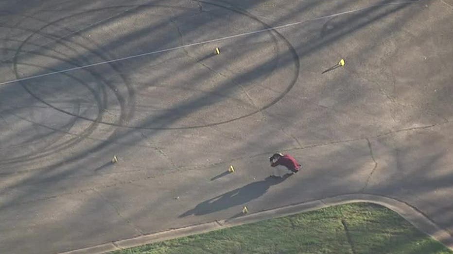 Police investigate a teen's death during a double shooting at a LaGrange park on March 10, 2022.