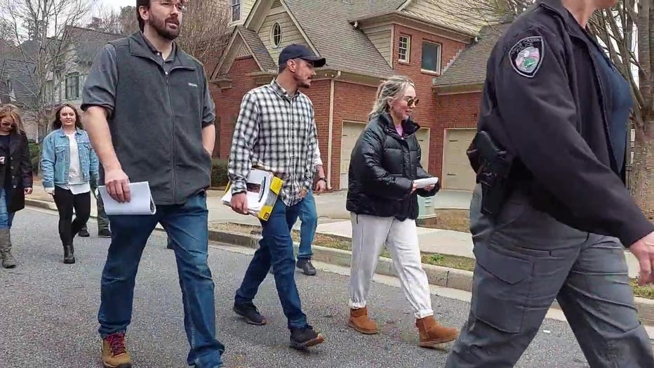 Family and friends of Ciera Breland canvass neighborhoods off Medlock Bridge Road on March 11, 2022 where she may have visited during her stay in Georgia