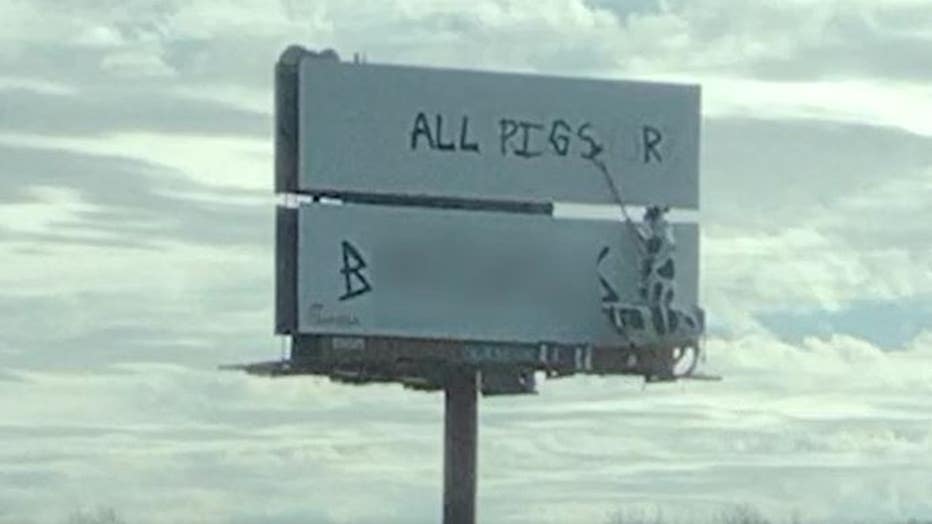 Photo of Chick-fil-A billboard along I-20 in Georgia that was vandalized (FOX 5).