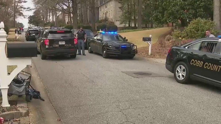 Police investigate after a man was shot and run over in a Cobb County neighborhood on March 7, 2022.
