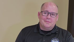 Wounded Carrollton cop walks through police department one year after being shot in line of duty