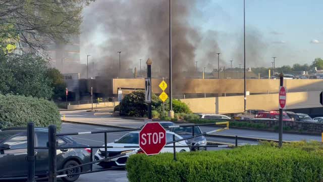 Car catches fire at Lenox Square Mall parking garage, one person injured