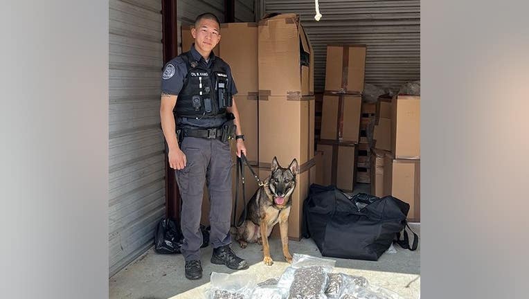 Duluth K9 Clodo pictured with his handler (Duluth Police Department).