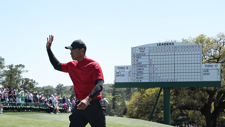 AUGUSTA, GEORGIA - APRIL 10: Tiger Woods waves to the crowd on the 18th green after finishing his round during the final round of the Masters at Augusta National Golf Club on April 10, 2022 in Augusta, Georgia. (Photo by Gregory Shamus/Getty Images)