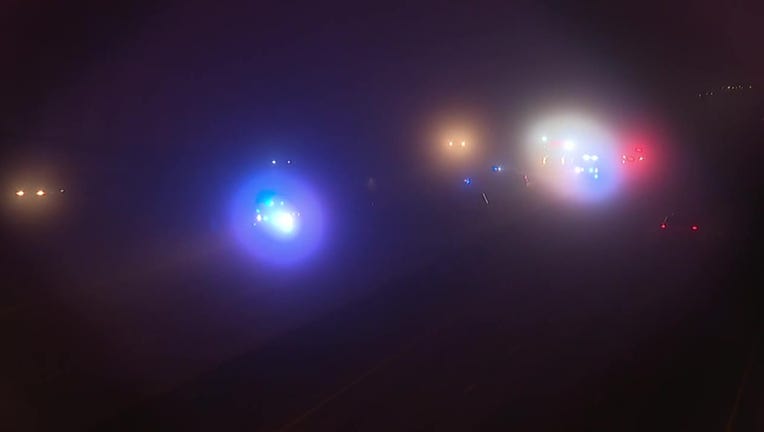 Dense fog obscures a crash along I-20 in DeKalb County that killed one person and injured another on April 17, 2022.