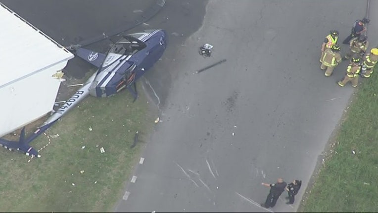 First responders at the scene of a helicopter crash on Highway 53 in Calhoun on April 12, 2022. (FOX 5 Atlanta)
