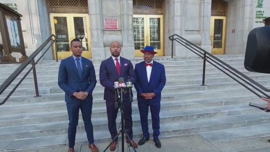 The lawyers for Devin Nolley discuss his civil case in front of the Fulton County Courthouse on April 15, 2022.