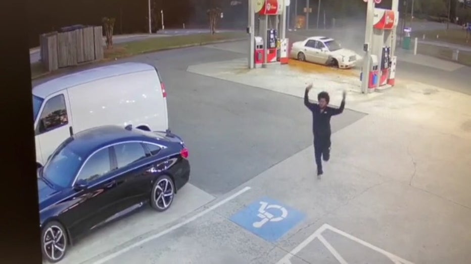 Noah Washington is seen running from the car he just crash in Kennesaw on April 24, 2022, according to police.