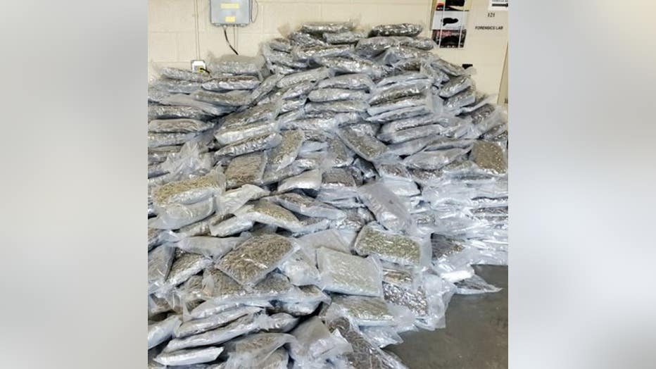Officers located 533-lbs of vacuumed-sealed marijuana in multiple boxes (Duluth Police Department).