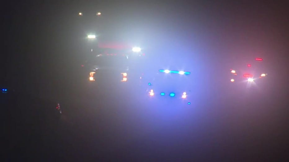 Dense fog obscures a crash along I-20 in DeKalb County that killed one person and injured another on April 17, 2022.