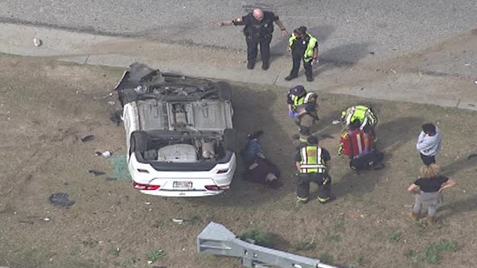 First responders treat a person lying roadside on I-85 in Atlanta on April 13. 2022. (FOX 5 Atlanta)