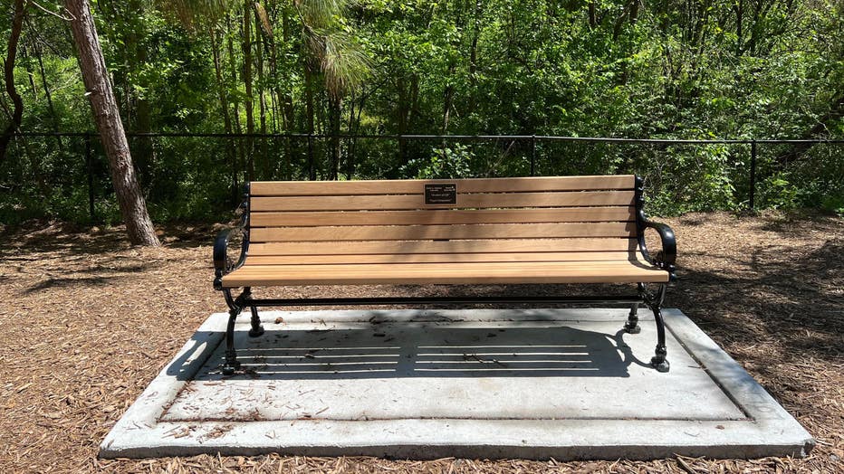 A bench inside Piedmont Park dedicated to Katie Janness and her dog Bowie.