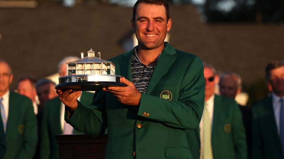 AUGUSTA, GEORGIA - APRIL 10: Scottie Scheffler poses with the Masters trophy during the Green Jacket Ceremony after winning the Masters at Augusta National Golf Club on April 10, 2022 in Augusta, Georgia. (Photo by Gregory Shamus/Getty Images)