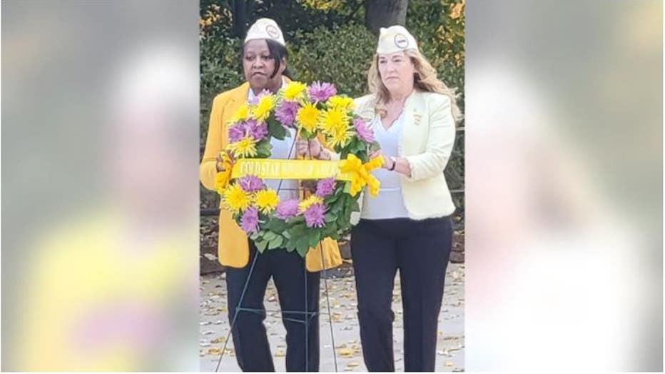 Tamra-Sipes-at-right-and-another-Gold-Star-Wife-are-shown-laying-a-wreath-at-Arlington-National-Cemetery-at-the-Tomb-of-the-Unknown-Soldier-on-Veterans-Day-in-2021.-Tamra-Sipes.jpg