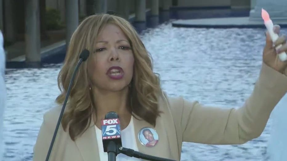 Rep. Lucy McBath speaks at a candlelight vigil for victims of shooting crimes at the King Center on April 20,, 2022.