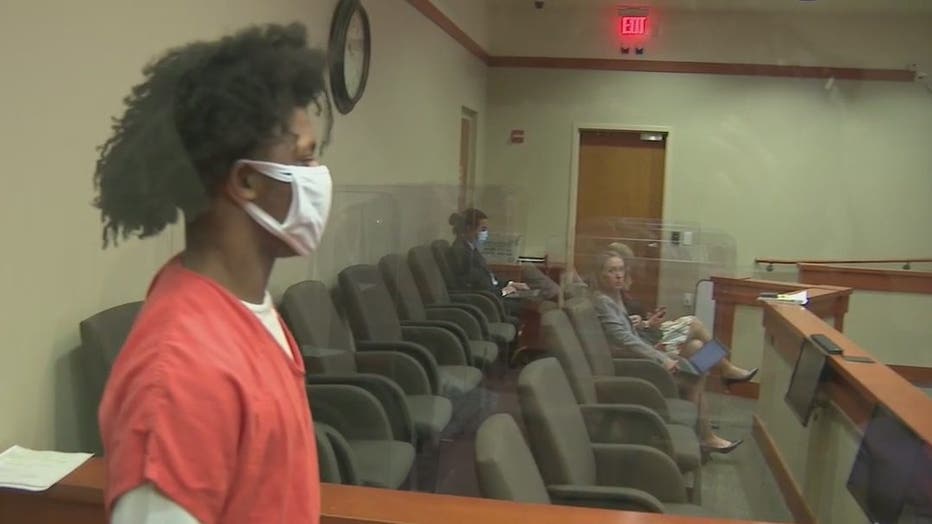 Christoper Cullens walks into a courtroom for a plea hearing on April 15, 2022.
