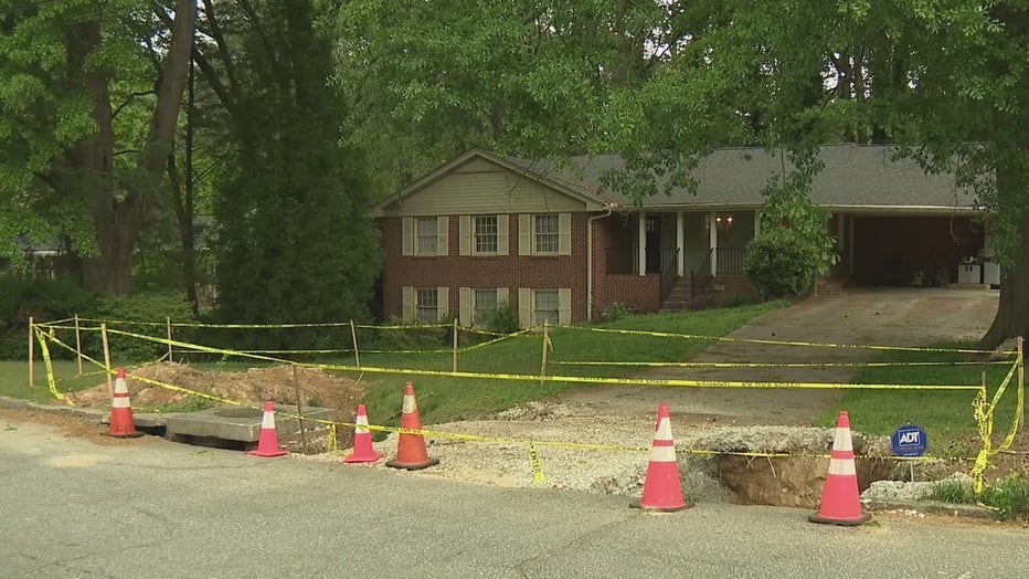 A massive sinkhole caused by a storm drain has left much of a front yard in DeKalb County unusable.