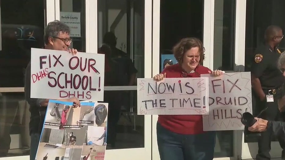 Parents and students supporting Druid Hills High rally outside a DeKalb County School Board meeting on April 18, 2022.