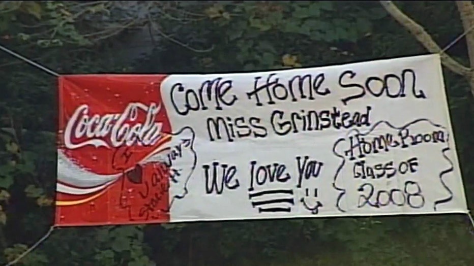 A banner of love and support hung outside Irwin County High School expresses love for teacher Tara Grinstead shortly after her disappearance in 2005. (FOX 5)