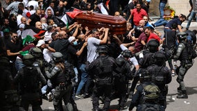Israeli police beat pallbearers at funeral for journalist Shireen Abu Akleh