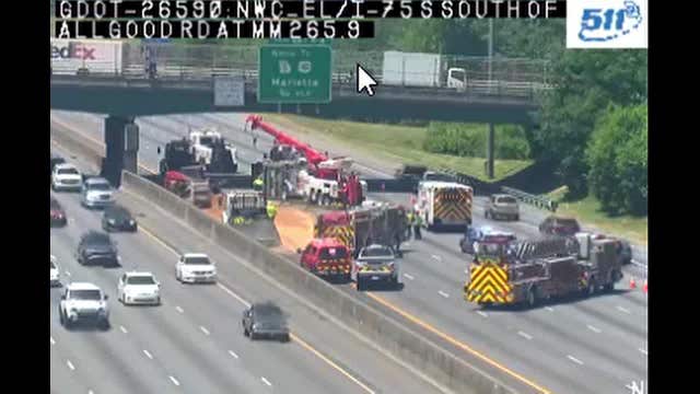 Overturned dump truck causes traffic jam on I-75 in Cobb County
