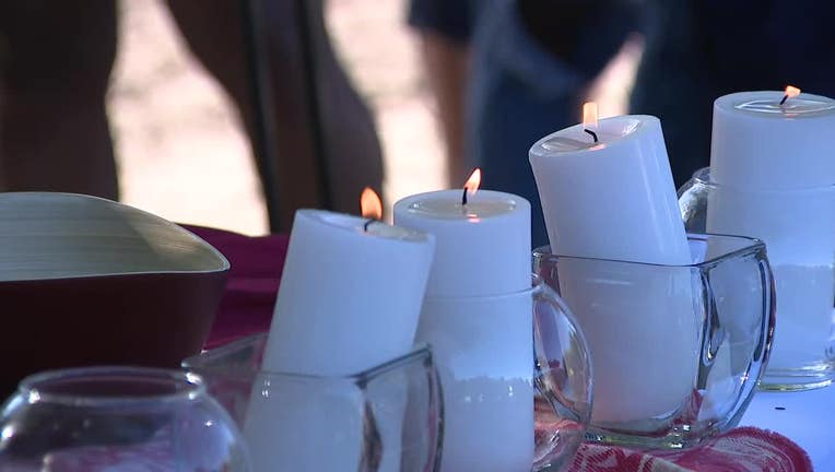 Candles burn during a vigil on May 17, 2022, for the victims of the Buffalo mass shooting