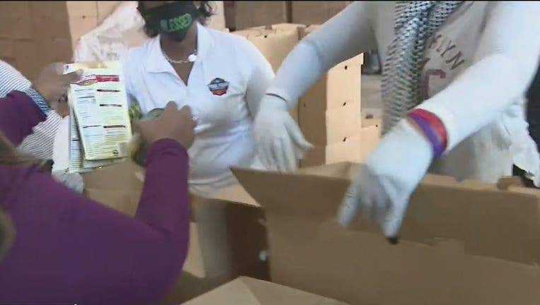 Faith leaders and DeKalb County officials team up to distribute food boxes to those in need on December 14, 2021.