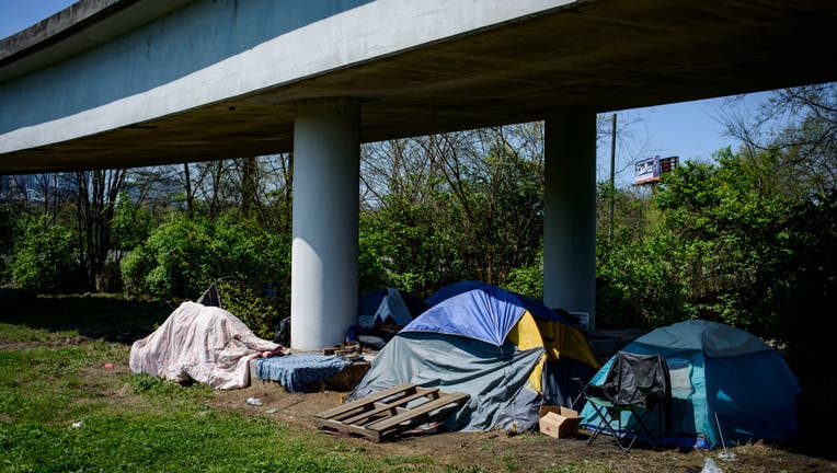 Multiple tents rest underneath an overpass in East Nashville.