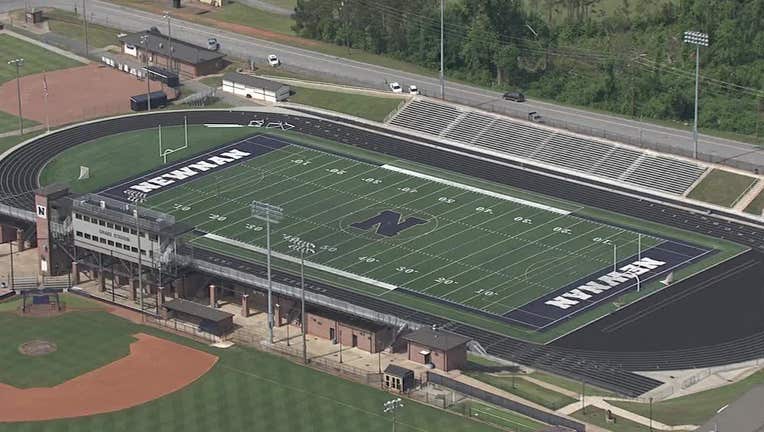 The principal of Newnan High School said police are investigating a threat written in a bathroom at the football stadium. 