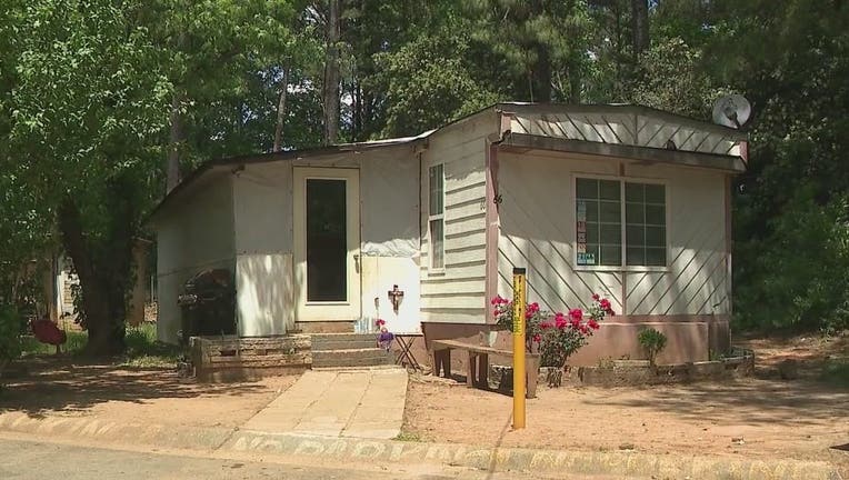 Police investigate after a woman was killed at a mobile home park off Tara Boulevard in Jonesboro.