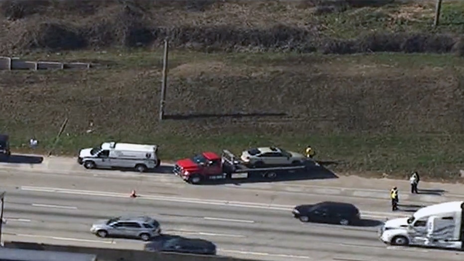 DeKalb County police investigate a deadly shooting along I-285 near Lawrenceville Highway on Feb. 1, 2022.