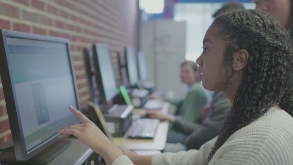 This image from a promotional video for Grant’s World Youth Job Resources Center shows teens using the center's resources to become employed.