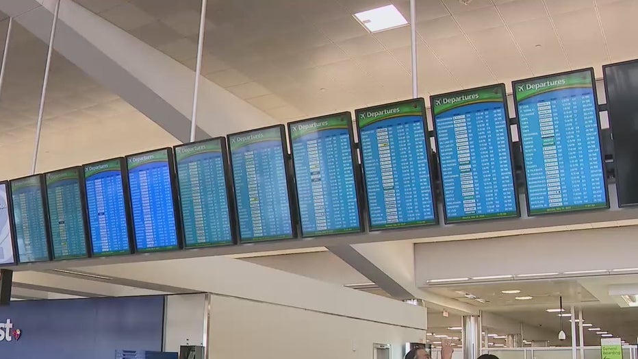 Cancellations fill the flight schedule board at Atlanta's airport on Memorial Day 2022.