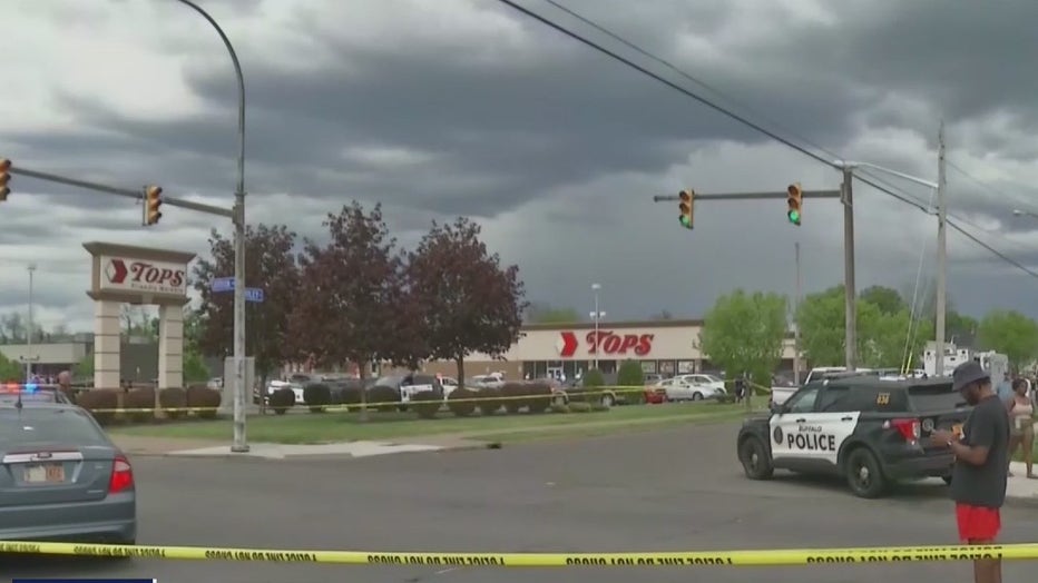 Police swarm a grocery store in Buffalo, New York after a deadly mass shooting which investigators now believe was a hate crime on May 14, 2022.