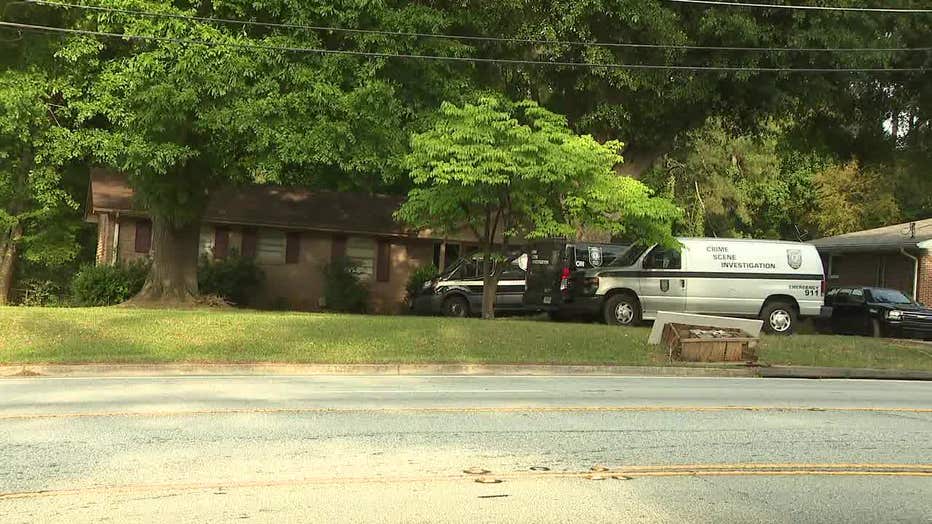 Investigators search a home along Panola Road for evidence in the stabbing death of a DeKalb County pastor on May 19, 2022.