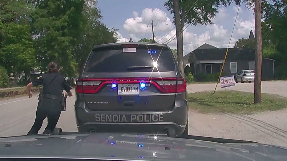 Senoia police officers scramble after a driver took off during a traffic stop on May 2, 2022.