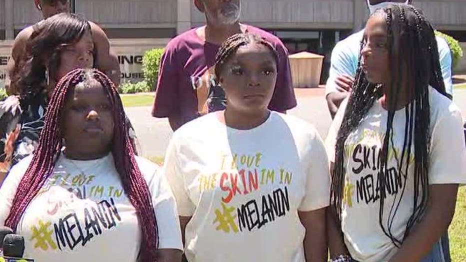 Attorney Harry Daniels said the students were suspended after a silent protest during breaks in class. They were told to turn shirts that said, "I love the skin I'm in #Melanin," inside out, or they would face suspension. 