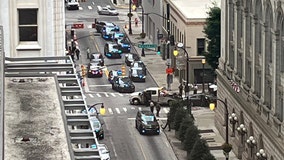 Law enforcement search for armed suspect who fled Downtown Atlanta traffic stop, crashed into pole