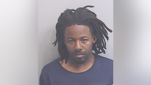 Police on the lookout for 'armed and dangerous' person of interest in deadly Atlanta motel shooting