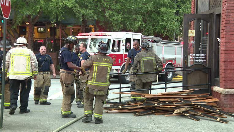 Firefighters work to put out a small blaze at Rocky Mountain Pizza off Hemphill Avenue in Atlanta on June 6, 2022.