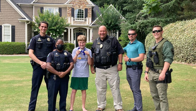 The Roswell Police Department held a parade for a local boy who earned two gold medals at Special Olympics Georgia.