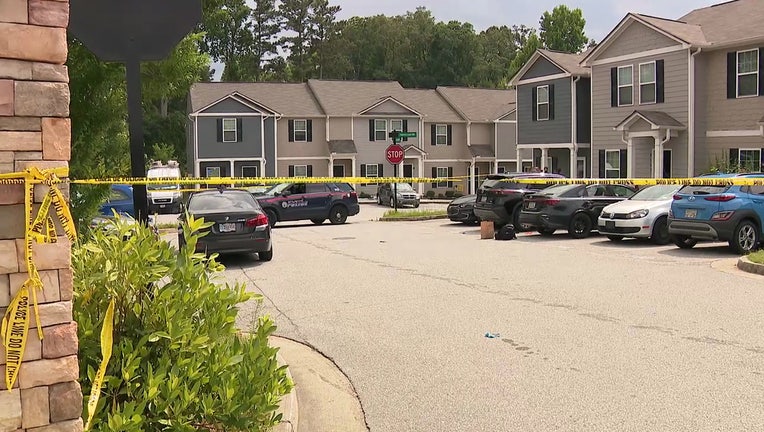 Atlanta Police Department investigators at an apartment complex in SW Atlanta investigating a road rage shooting. 