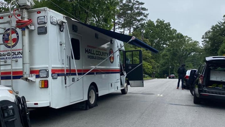 Gainesville police and said tactical teams responded to a home where a man fired multiple shots with a rifle. A Hall County mobile command vehicle was at the scene. 