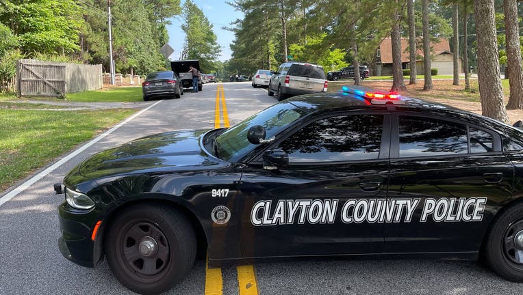 The Clayton County Police Department arrested a man suspected of driving a stolen car dragged an officer when trying to escape before a K9 officer arrested them.