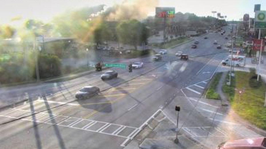 Smoke can be seen billowing from a motel along U.S. 441 near I-85 on June 20, 2022.