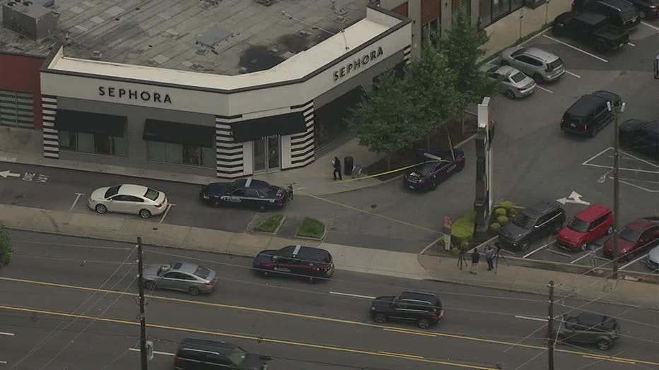 Police investigate after a bullet went through the window of a popular Buckhead cosmetics shop on June 7, 2022.