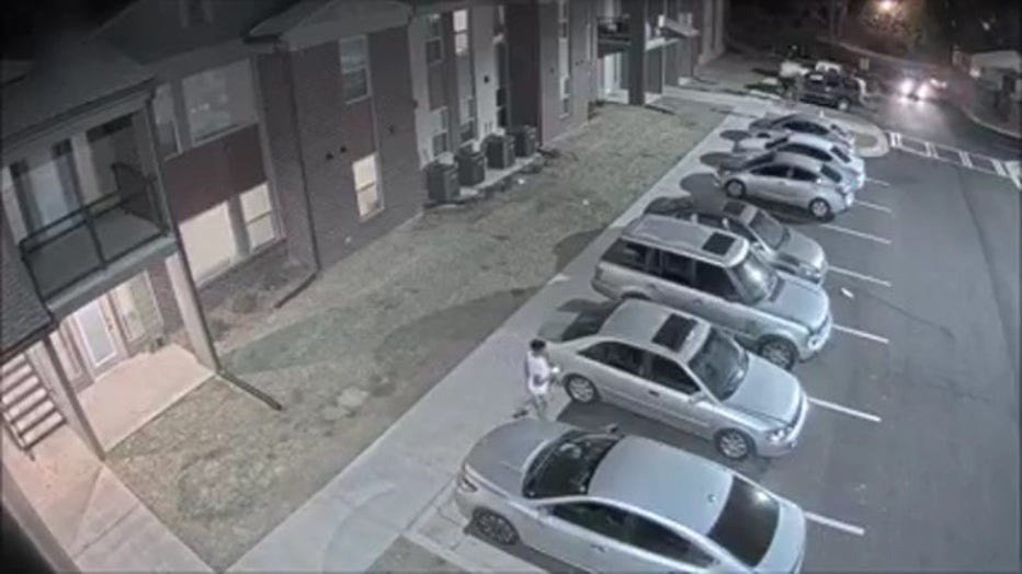 A man in a white T-shirt is seen leaving an apartment complex in LaGrange. Moments later, police said he and a driver get into a shootout on May 11, 2022.